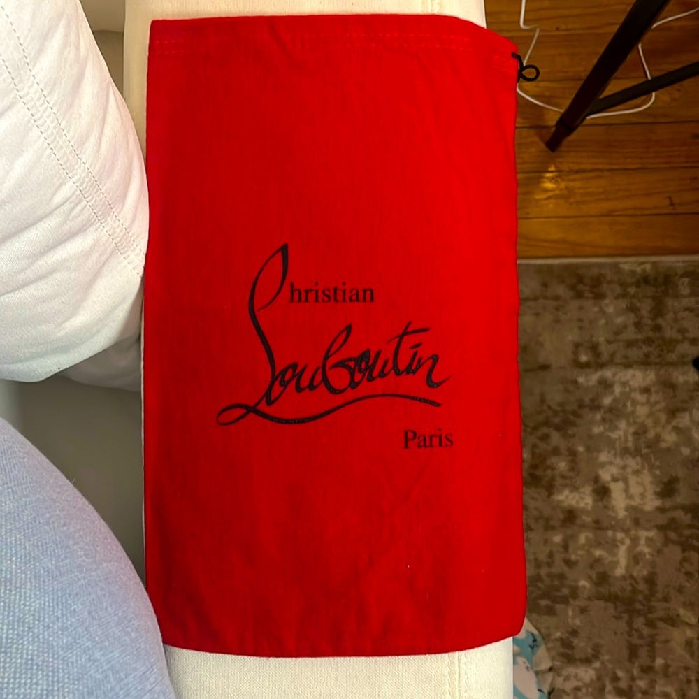 CHRISTIAN LOUBOUTIN RED DUST BAG ; 14”length and 9 1/2 width.
